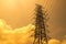 Electrical high voltage pole and cloudy sky in evening time