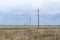 Electrical lines and pillars across the plain of upper Tibet