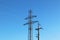 Electrical network of high voltage. Transportation of electricity through the high-voltage line. Metal tower with wires and cables