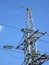 Electrical powerlines, electricity pylons, high voltage wire cables, blue sky