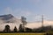 Electrical pylons in foggy countryside