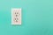 Electrical Sockets In Colorful Bright Teal Wall