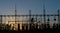 Electrical substation silhouette on the dramatic sunset background.