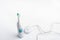 Electrical toothbrush with battery charger for higiene of mouth cavity on white background