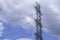 Electrical tower station wiring power with cloudy and blue sky background, High voltage station post