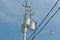 electrical transformers hanging on light pole against dark blue sky