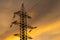 Electrical transmission tower iron high sunset sky yellow clouds