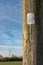 Electrical utility poles seen carrying high-voltage cables to a small english village.