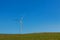 Electrical wind power mill over the blue sky