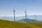 Electrical wind power mills over the blue sky