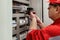 Electrical wiring repair. Repairman repairs electrical panel