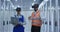 Electrical workers in reflective vests using VR headsets