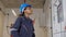 Electrical young woman engineer examining maintenance cabinet system electric in the control room.