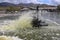 Electrically powered paddle wheels that ripple the water tank with king prawns. Floating equipment on the water surface of pool.