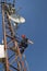 Electrician adjusts the antenna for the high power scada system