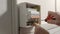 Electrician assembles electrical panel. Close up of a mans hands tightening a screw with a screwdriver and turning on