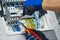 Electrician assembling power switchboard