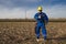 Electrician in blue uniform with yellow helmet