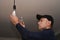 An electrician changes an old incandescent lamp to an energy-saving LED lamp.