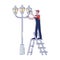Electrician changing light bulbs in street light. Lineman repair streetlight change lamp