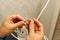 Electrician connecting the cables of the television antenna during the renovation of the house. master assembling