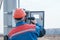 Electrician engaged in the installation of electricity meter on the support of power lines . the process of the electrician. the