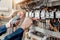 Electrician engineer uses a multimeter to test the electrical installation and power line current in an electrical system control