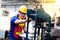 Electrician Engineers repairing machinery in industrial plants. worker Working at the Heavy Industry Manufacturing Facility