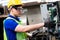 Electrician Engineers repairing machinery in industrial plants. worker Working at the Heavy Industry Manufacturing Facility