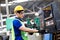 Electrician Engineers repairing machinery in industrial plants. worker Working at the Heavy Industry Manufacturing Facility