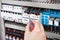 Electrician examining fusebox with screwdriver