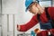 Electrician Installing Electric Outlet Inside Concrete Wall