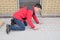 Electrician installing heating electrical cable on cement floor