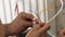 Electrician repairing an electrical installation, using a lighter, close-up