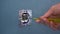 Electrician repairing a wall outlet with a screwdriver. Close-up.