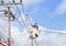 Electrician repairing wire of the power line with bucket hydraulic lifting platform