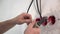 Electrician stripping copper cable with cable stripper pliers close up