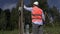 Electrician take pictures near high-voltage lines and transformer