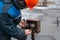 An electrician uses a universal voltage probe to ring a packet switch.