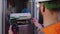 Electrician using multimeter to check switchboard