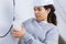 Electrician woman installing light-switch in new house