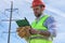 Electrician working in a helmet wearing gloves