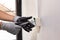 Electrician working safely on sockets of a residential electrical system