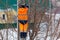 Electrician works on a pole in winter