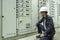 Electricians are checking electrical control panels in industrial plants