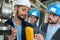 Electricians measuring voltage in distribution board