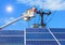 Electricians repairing wire of the power line on bucket hydraulic lifting platform with photovoltaics in solar power station