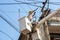 Electricians working on cable car to repair the power line