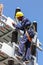 Electricians working on high voltage power lines