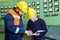 electricians with yellow helmet working in a power station